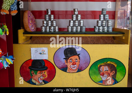 16.06.2019, Vienna, Austria, Europe - A colourful booth with cans throwing at the Wiener Prater amusement park. Stock Photo