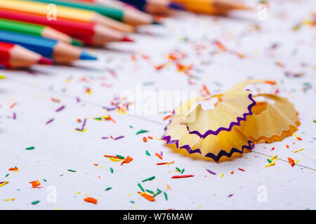 Shavings and colored pencils on a white background Stock Photo