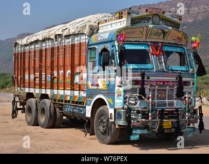 Typically colourful Tata truck, personalised by its owner with brightly painted motifs and decorations, Chai Rest Stop, Rajasthan, India, Asia. Stock Photo