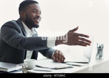 African American businessman extending hand to shake Stock Photo