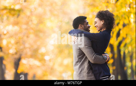 Loving couple hugging and looking into each other eyes Stock Photo