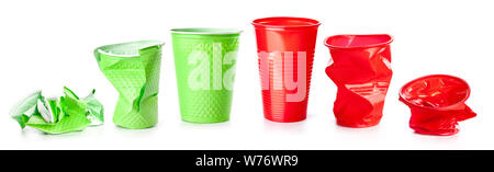Green and red plastic cups isolated on white background, recyclable garbage Stock Photo