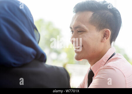 Portrait of business people talking and smiling. Stock Photo