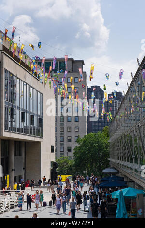 Decorations hang from the Royal Festival Hall in summer at the Southbank centre in London UK, Europe’s largest centre for the arts. Stock Photo