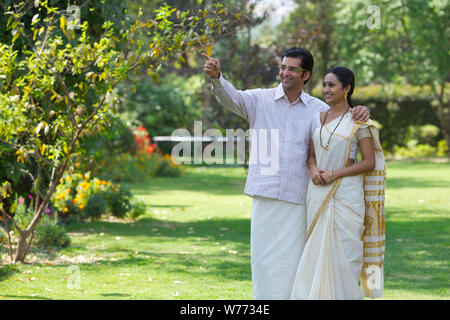South Indian man showing wife jewelery Stock Photo - Alamy