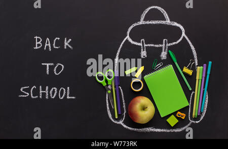 Eco green and recycling stationery inside transparent backpack Stock Photo