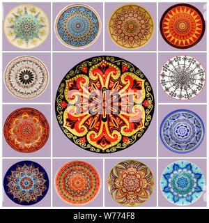 Set of decorative ceramic dishes hand-painted with acrylics and floral pattern on a purple background. Stock Photo