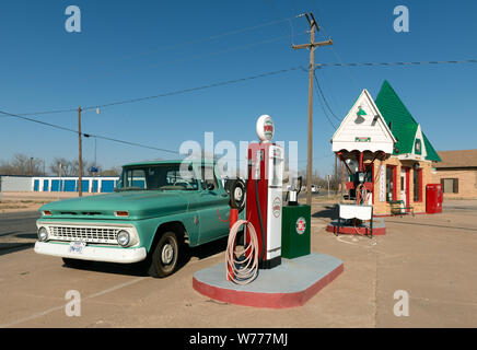 A carefully restored old Sinclair gasoline station in Snyder, the seat of Scurry County, Texas Physical description: 1 photograph : digital, tiff file, color.  Notes: The small, triangular building dates to 1935. Two men, Franklin Bryant and Lynn Fuller, who specialize in restoring gas pumps and vintage soda machines, restored this Texas landmark, which closed about 1970. Out front is a sign noting the price of gas in the station's heydey, 29.9 cents per gallon.; Title, date, and keywords based on information provided by the photographer.; Gift; The Lyda Hill Foundation; 2014; (DLC/PP-2014:054 Stock Photo
