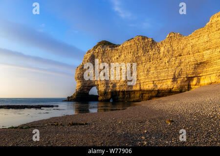 Falaise d'Amont, iconic limestone cliff of Normandy Coast, Etretat, dusk scenery or landscape, France Stock Photo