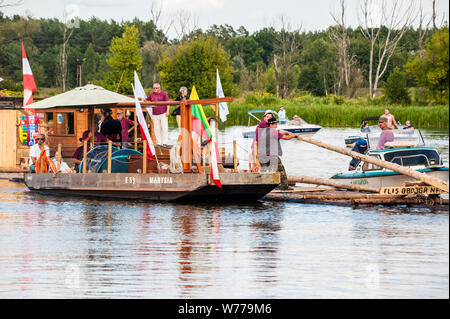 Reconstruction of traditional timber rafting on The Narew river in north-eatern Poland. Stock Photo