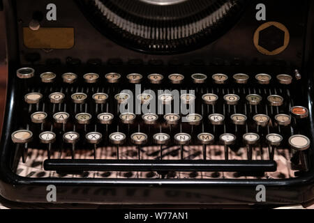 Antique metal typewriter. Vintage typing machine keyboard closeup