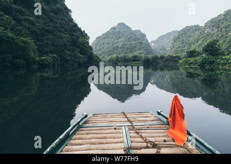 View over Tam Coc national wetlands reserve from the tourist boat nose in Ninh Binh, Vietnam Stock Photo