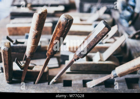 Old carpentry tools in an Asian wooden workshop Stock Photo