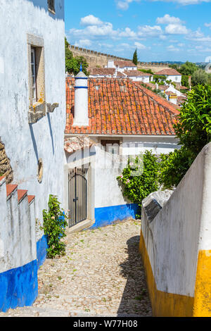 Typical narrow street in the fortified city of Obidos, Leiria District, Estremadura, Portugal Stock Photo