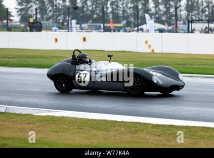 Ben Adams driving his 1961, Lola Mk1  down the Wellington Straight, at Silverstone during the Stirling Moss Trophy for Pre '61 Sportscars Stock Photo