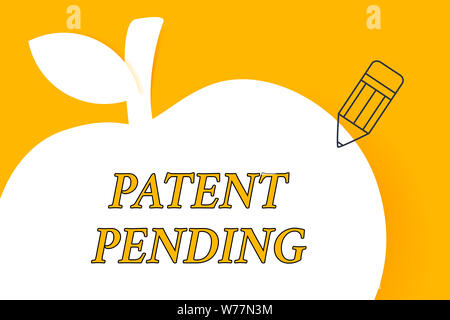Writing note showing Patent Pending. Business concept for Request already filed but not yet granted Pursuing protection Pencil Outline Pointing to Emp Stock Photo