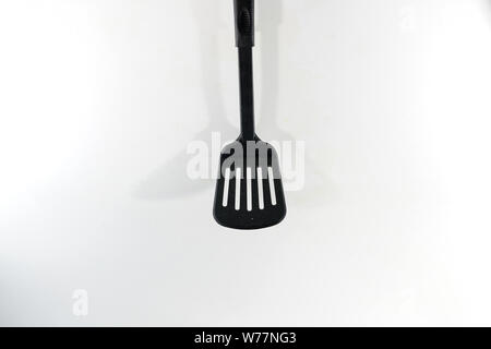 A spatula, also pan knife, slot turner, baking shovel, roasting turner, frying pan, or kitchen friend called, is a kitchen appliance for turning food Stock Photo