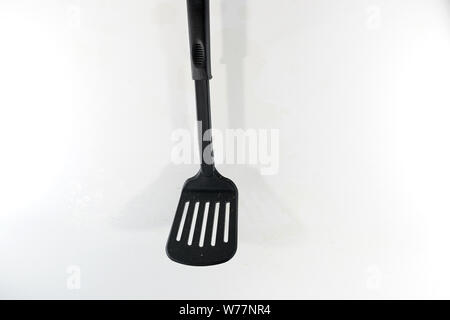 A spatula, also pan knife, slot turner, baking shovel, roasting turner, frying pan, or kitchen friend called, is a kitchen appliance for turning food Stock Photo