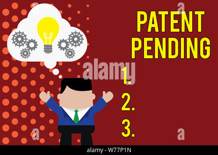 Writing note showing Patent Pending. Business concept for Request already filed but not yet granted Pursuing protection Man hands up imaginary bubble Stock Photo