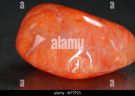 Quartz also called deep quartz with mineral inclusions in the studio in front of black background photographed in Marco mode Stock Photo