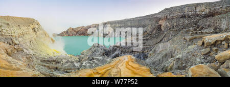 Panoramic shot of the Ijen volcano or Kawah Ijen on the Indonesian language. Famous volcano containing the biggest in the world acid lake and sulfur Stock Photo