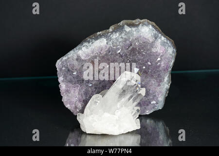 Quartz also called deep quartz with mineral inclusions in the studio in front of black background photographed in Marco mode Stock Photo
