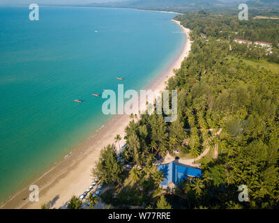 Aerial drone view of a beautiful empty sandy beach and tropical coastline Stock Photo