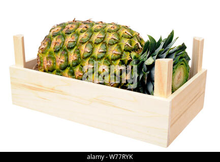 pineapple in crate isolate on white Stock Photo