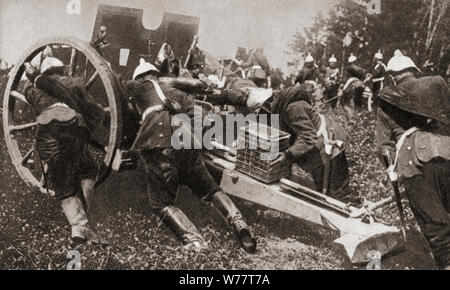 German artillery using man power to get their guns into position during WWI.  From The Pageant of the Century, published 1934. Stock Photo