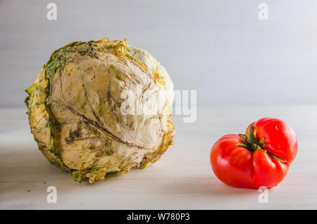 ugly food cabbage and tomato on a white background Stock Photo