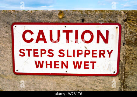 'Caution Steps Slippery When Wet' Signage Stock Photo