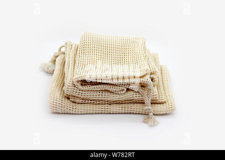 Eco natural bags for sale fruits and vegetable on white background.  Plastic free lifestyle. Stock Photo