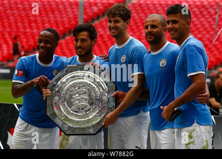 LONDON, ENGLAND. AUGUST 04: L-R Manchester City's Raheem Sterling, Manchester City's David Silva, Manchester City's John Stones, Manchester City's Kyl Stock Photo