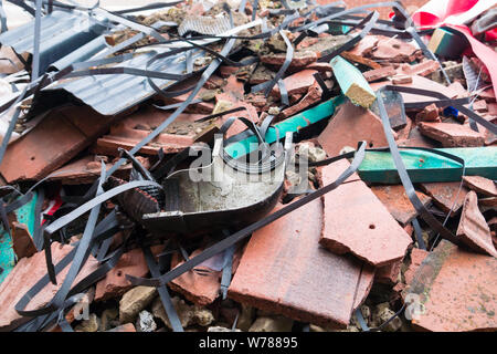 Assorted Roofing Waste in a Skip Stock Photo