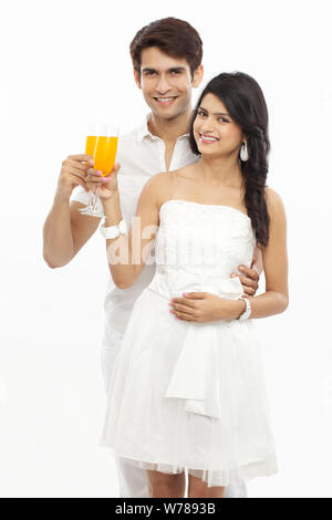 Young couple drinking juice Stock Photo