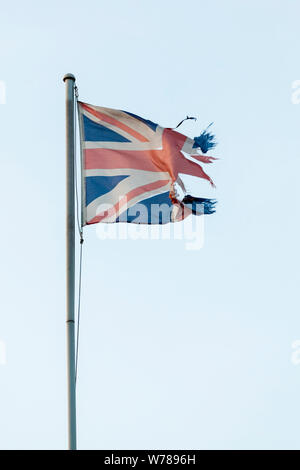 Ripped or torn Union Jack flag, UK Stock Photo