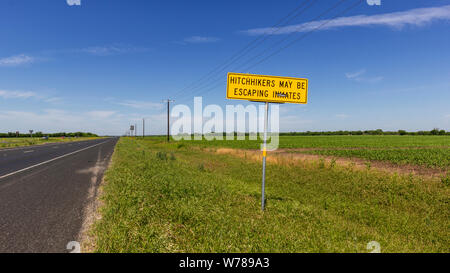 Hitchhikers may be escaping inmates sign. Between Hondo and Sabinal ...