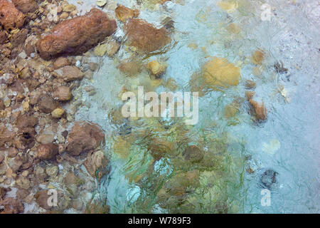 River stones under clear, clean and fresh cool water Stock Photo