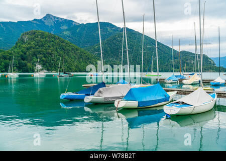 ST. GILGEN, AUSTRIA - JULY 11, 2019: Boats and yachts in the marina in Sankt Gilgen village in the north-western shore of the lake Wolfgangsee Stock Photo