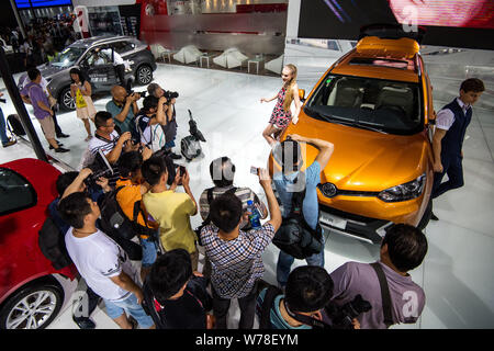 --FILE--People visit the stand of MG of SAIC during an automobile ...