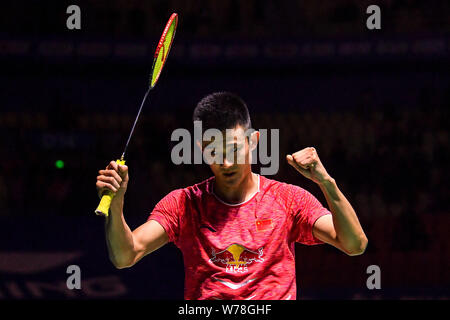 Chen Long of China celebrates after defeating Viktor Axelsen of Denmark in their final match of the men's singles during the Tahoe China Open 2017 bad Stock Photo