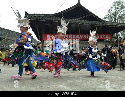 A Chinese villager of Miao ethnic group wearing traditional costumes  practises ''Miao stickfighting'', a unique martial art of the Miao Martial  Arts i Stock Photo - Alamy