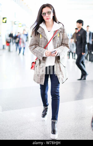 Chinese actress Li Bingbing is pictured at the Beijing Capital International Airport in Beijing, China, 4 November 2017. Stock Photo