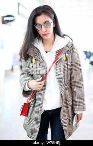 Chinese actress Li Bingbing is pictured at the Beijing Capital International Airport in Beijing, China, 4 November 2017. Stock Photo