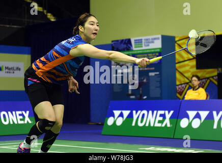 Sung Ji-hyun of South Korea returns a shot to He Bingjiao of China in their quarterfinal match of the women's singles during the YONEX-SUNRISE Hong Ko Stock Photo