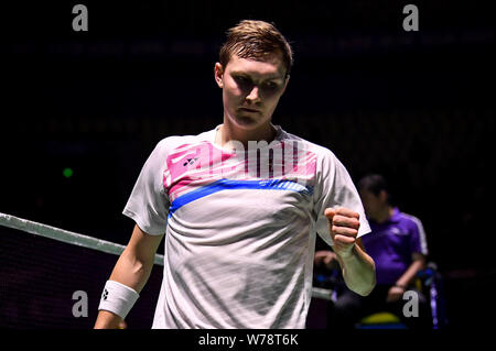 Viktor Axelsen of Denmark celebrates after scoring against Chou Tien-chen of Chinese Taipei in their quarterfinal match of the men's singles during th Stock Photo