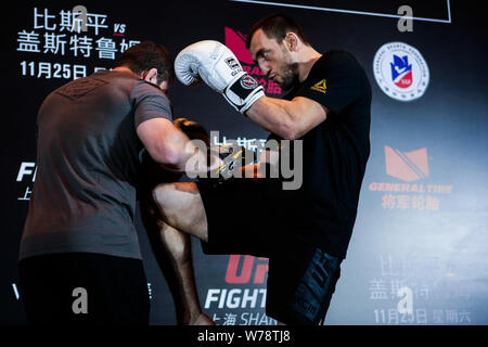 Russian heavyweight Sanshou kickboxer and mixed martial artist Muslim Salikhov, right, receives an interview during his open workout ahead of the 2017 Stock Photo