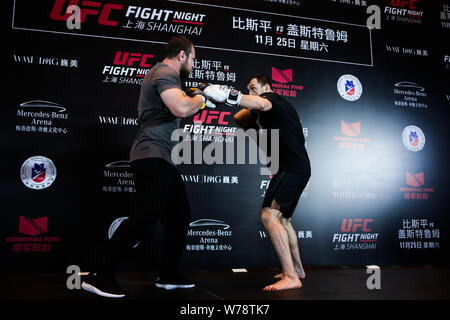Russian heavyweight Sanshou kickboxer and mixed martial artist Muslim Salikhov, right, receives an interview during his open workout ahead of the 2017 Stock Photo
