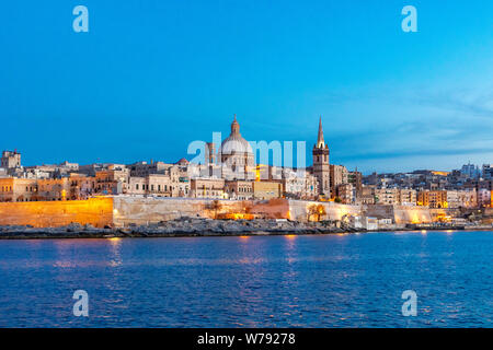 Scenic evening Valletta skyline view as seen from Gardjola Gardens in Senglea, Malta Stock Photo