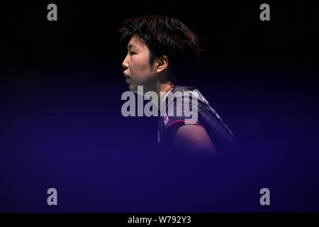 Akane Yamaguchi of Japan reacts as she competes against Saina Nehwal of India in their second round match of the women's singles during the Tahoe Chin Stock Photo